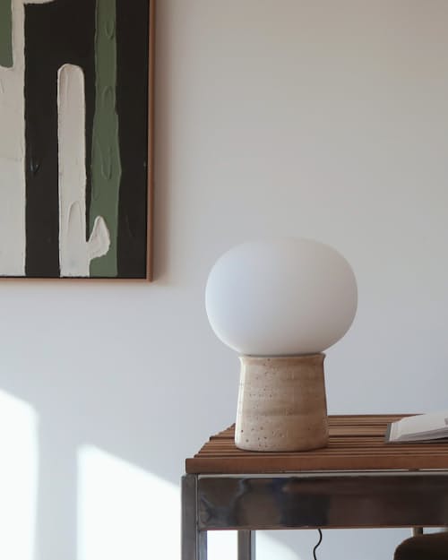 lifestyle image of Neptune Travertine Stone LED Table Lamp