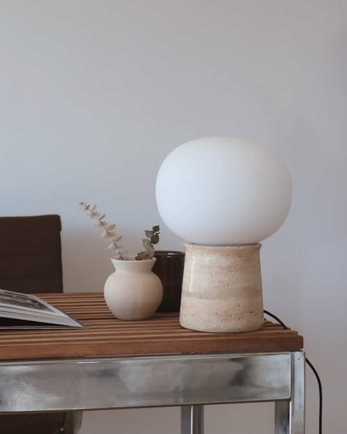 lifestyle image of Neptune Travertine Stone LED Table Lamp