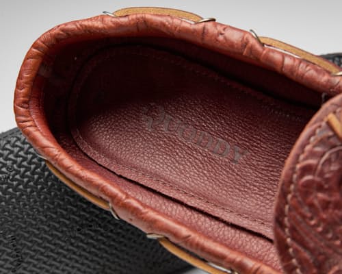 laydown detail image of Huckberry x Quoddy Coolslide Stamped Leather Slipper