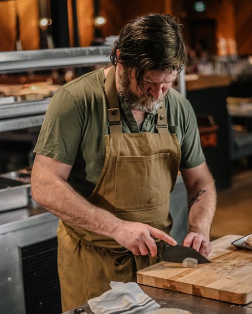 lifestyle image of Station - G10 Chef's Knife