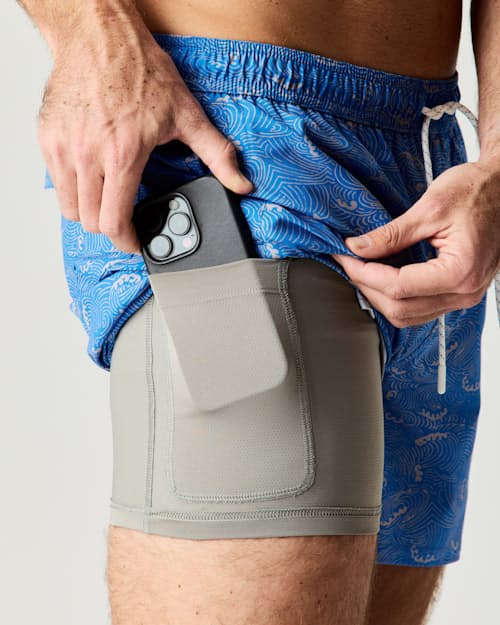 on model image of Performance Lined Swim Trunks - 5"