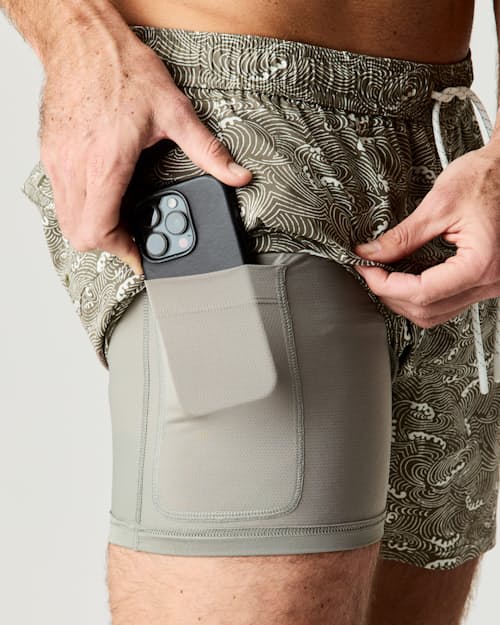 on model image of Performance Lined Swim Trunks - 5"