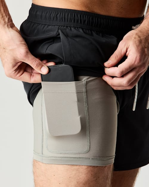 on model image of Performance Lined Swim Trunks - 5"