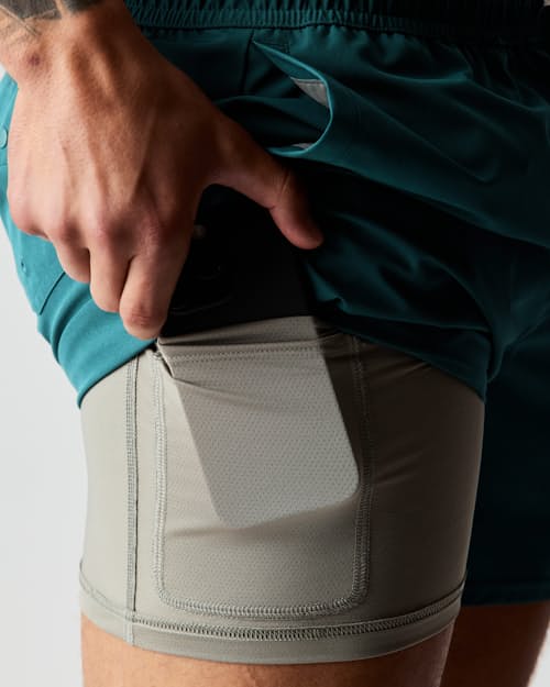 lifestyle image of Performance Lined Swim Trunks - 5"