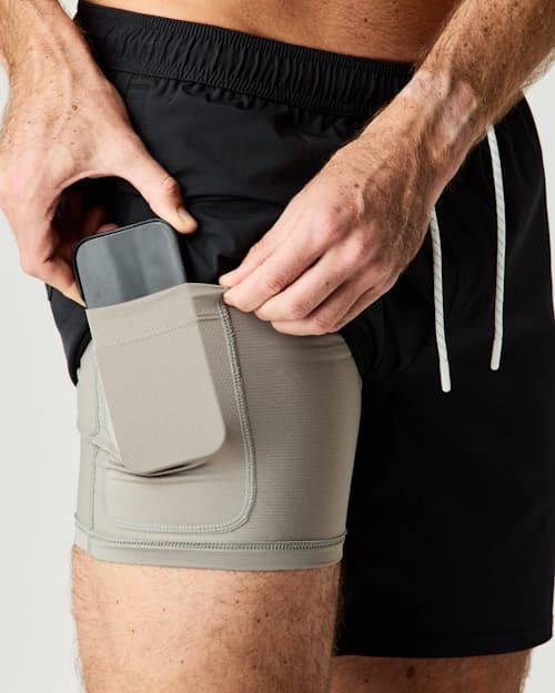 on model image of Performance Lined Swim Trunks - 7"
