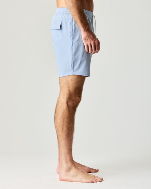 on model image of Performance Lined Swim Trunks - 7"