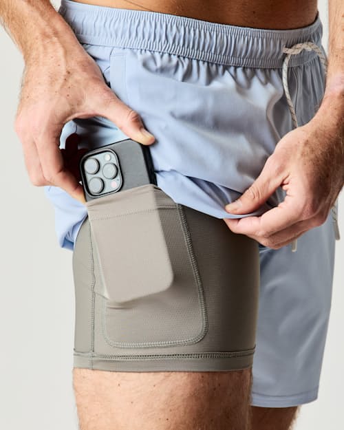 on model image of Performance Lined Swim Trunks - 7"