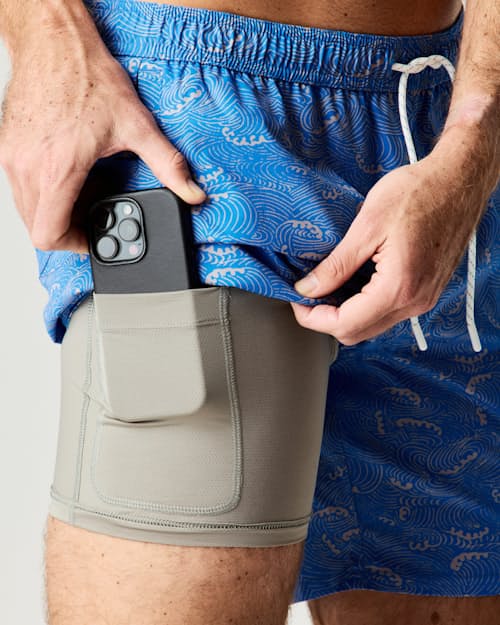 on model image of Performance Lined Swim Trunks - 7"