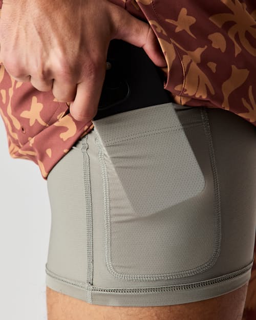 lifestyle image of Performance Lined Swim Trunks - 7"