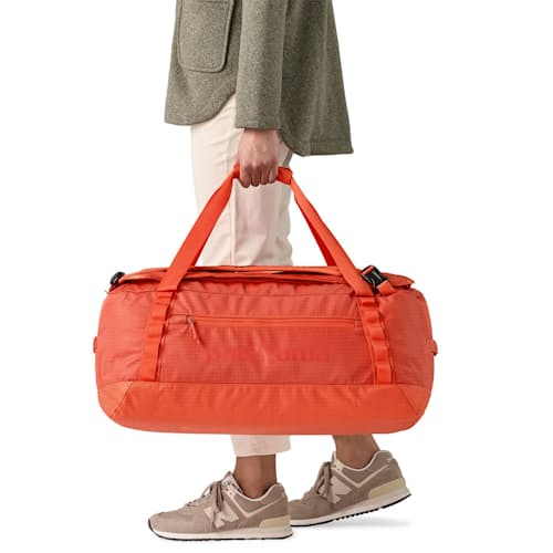 on model image of Black Hole Duffel Bag - 55L