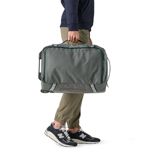 on model image of Black Hole Wheeled Duffel 40L
