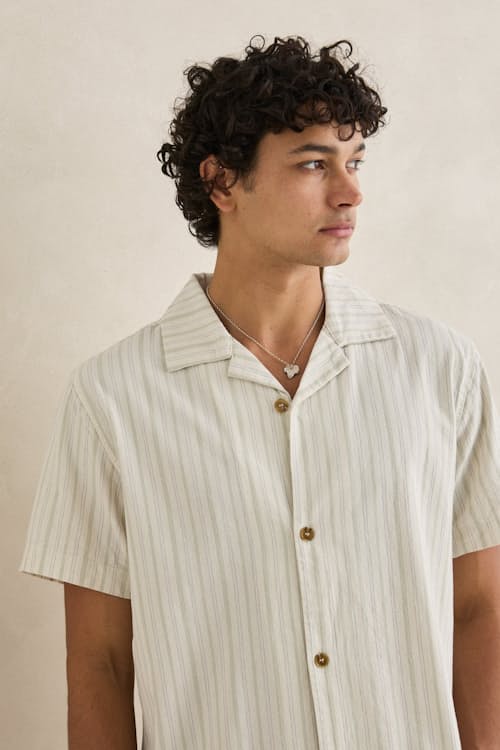 on model image of Vacation Stripe Short Sleeve Shirt