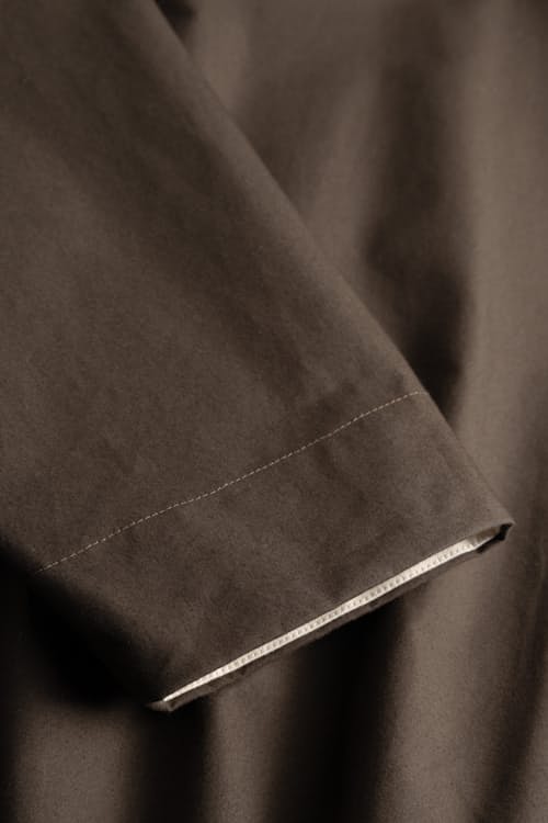 laydown detail image of Holmen Wax Raglan Light Jacket