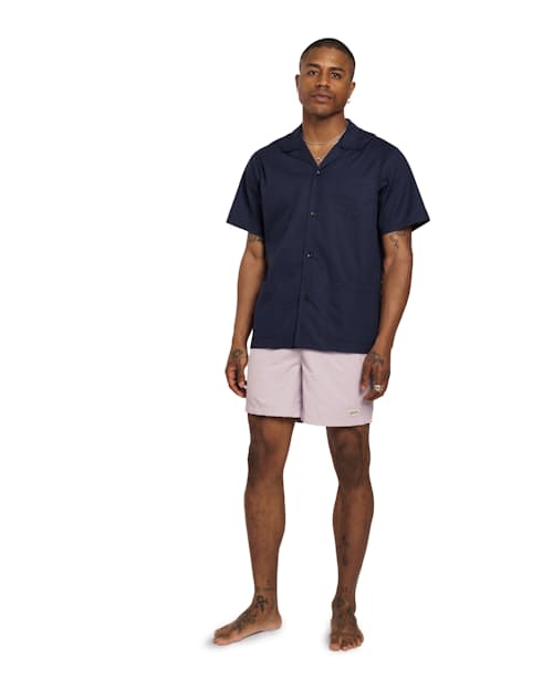 on model image of Classic Solid Swim Short - 5.5"