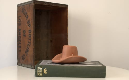 lifestyle image of Belle Star Cowboy Hat Candle