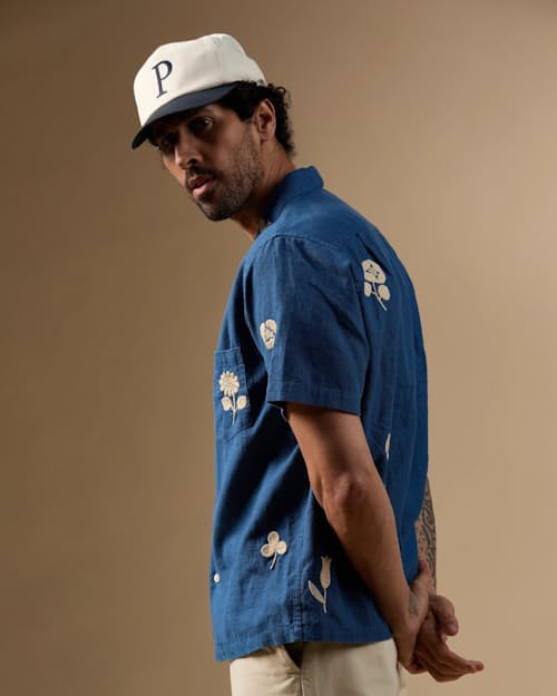 on model image of Embroidered Camp Collar Shirt