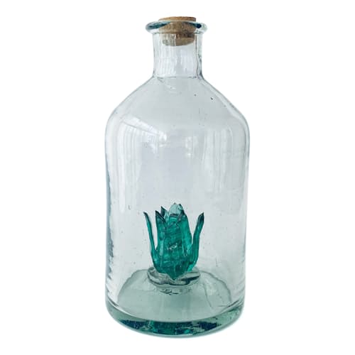 laydown image of Clear Bottle with Green Agave