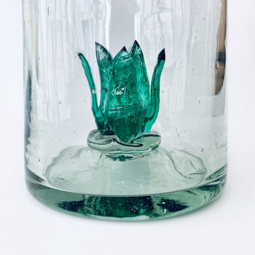 laydown detail image of Clear Bottle with Green Agave