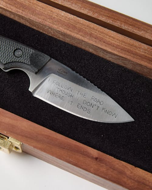 laydown detail image of I Follow the Road Buck 664 Fixed Blade Knife