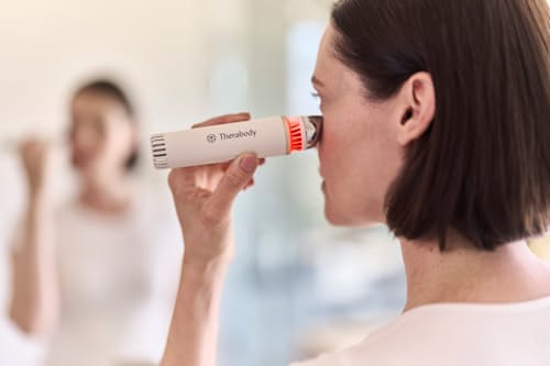 lifestyle image of TheraFace De-puffing Wand