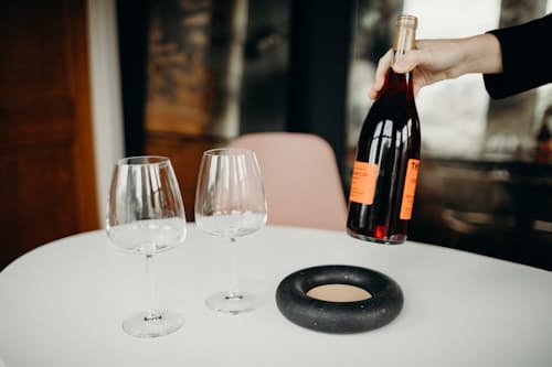 lifestyle image of Concrete + Cork Wine Bottle Coaster