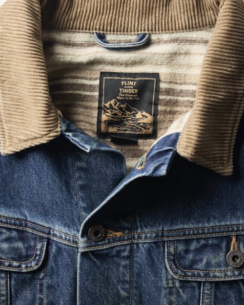 laydown detail image of Flannel-Lined Denim Trucker Jacket