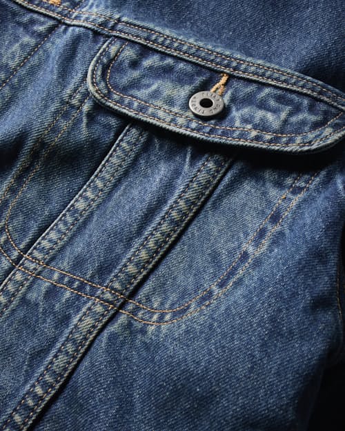laydown detail image of Flannel-Lined Denim Trucker Jacket