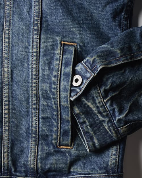 laydown detail image of Flannel-Lined Denim Trucker Jacket