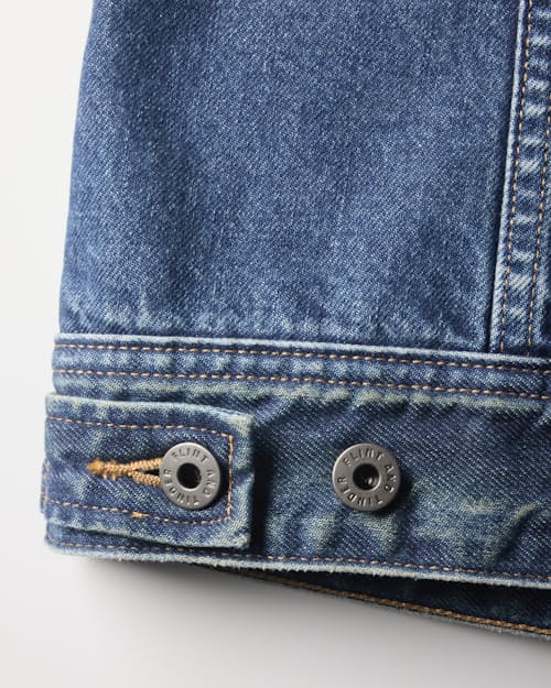 laydown detail image of Flannel-Lined Denim Trucker Jacket