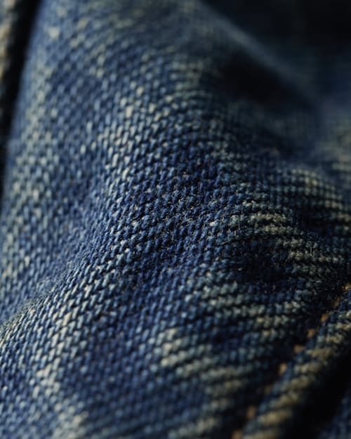 laydown detail image of Flannel-Lined Denim Trucker Jacket