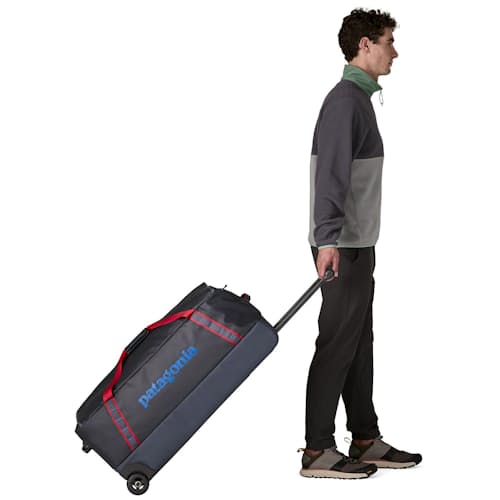 on model image of Black Hole Wheeled Duffel 100L