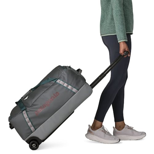 on model image of Black Hole Wheeled Duffel 70L