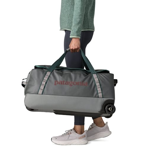 on model image of Black Hole Wheeled Duffel 70L