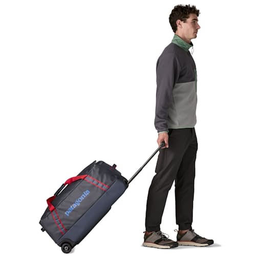 on model image of Black Hole Wheeled Duffel 70L