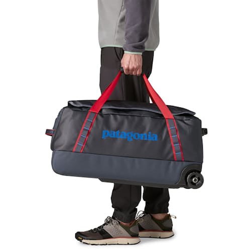 on model image of Black Hole Wheeled Duffel 70L