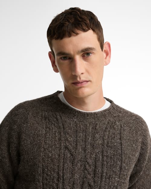 on model image of Scottish Made Natural Yarn Cable Crew