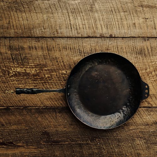 laydown image of Carbon Steel Farmhouse Skillet
