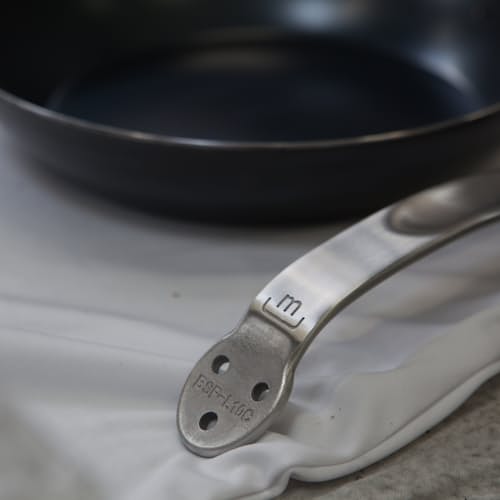 laydown image of Blue Carbon Steel Frying Pan