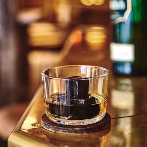 laydown image of Dark Granulite Hornblende Whiskey Stones with Tray