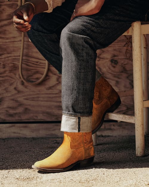 lifestyle image of The Waxy Kudu Roper Boot by Rios