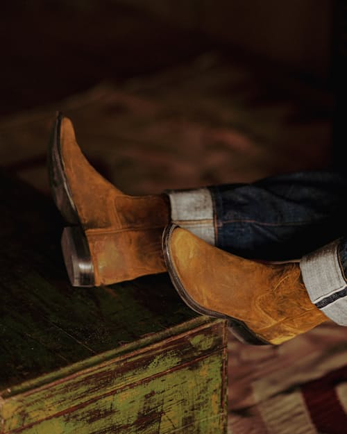 lifestyle image of The Waxy Kudu Roper Boot by Rios