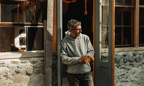 lifestyle image of 10-Year Pullover Hoodie