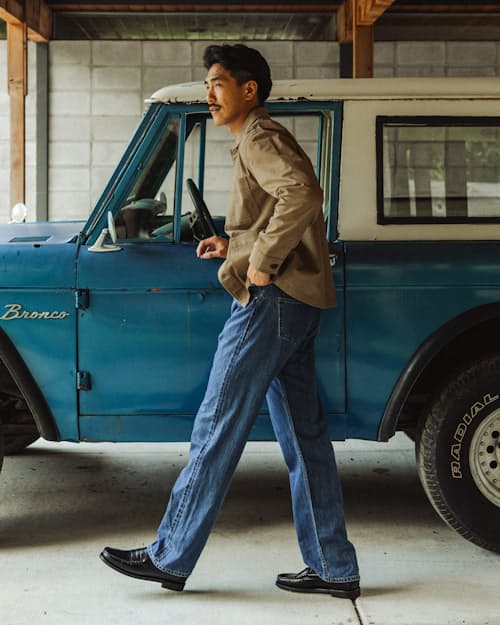 lifestyle image of Classic Tapered Selvedge Denim Jeans