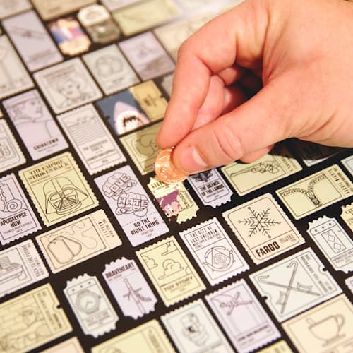laydown image of 100 Essential Films Scratch Off