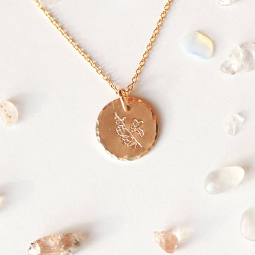 laydown image of Larkspur Floral Coin Necklace