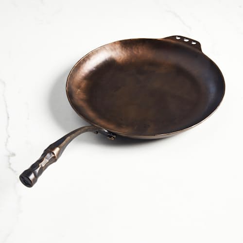 laydown image of Carbon Steel Farmhouse Skillet