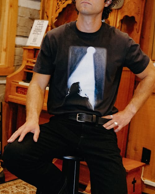 lifestyle image of Man in Black T-Shirt