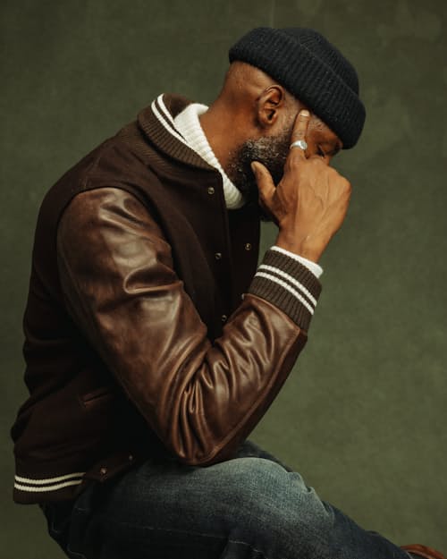 on model image of Leather and Wool-Blend Varsity Bomber Jacket