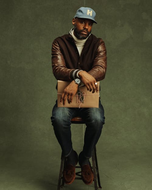 on model image of Leather and Wool-Blend Varsity Bomber Jacket