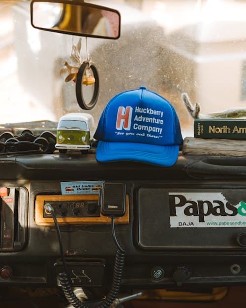 lifestyle image of Huckberry Adventure Company Foam Trucker Hat